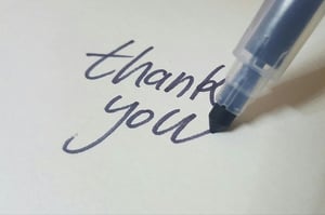 Blue marker writing thank you